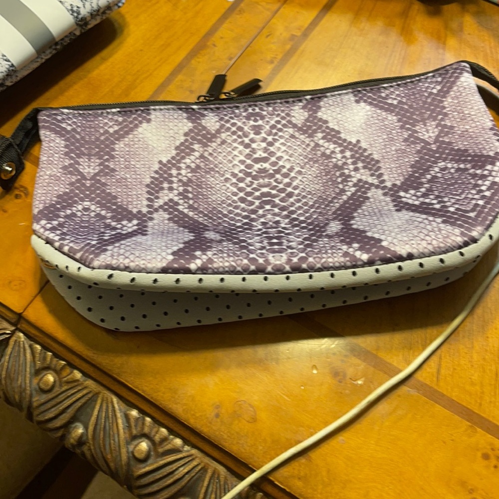 A medium sized tote or a makeup bag